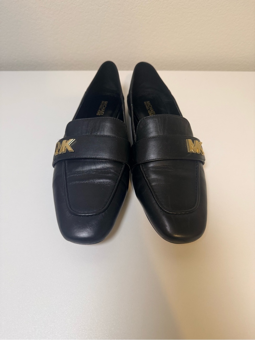 Lightly used, 7.5, Michael Kors Black Leather Loafers with Gold MK Accent